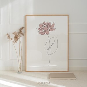 以下が含まれることがあります： 白い背景にピンクの花と葉1枚を描いたミニマルな線画で、明るい木製の額縁に入っています