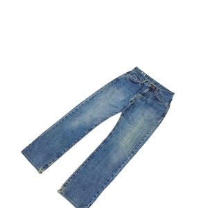 May include: A set of three ceramic mugs with a speckled, matte finish. The mugs are in shades of cream, light gray, and dark gray. Each mug has a simple, minimalist design and a rounded handle.