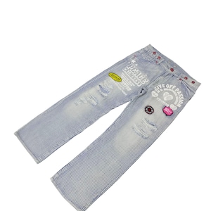 May include: A set of three ceramic mugs with a speckled, cream-colored glaze. Each mug features a different hand-painted floral design in shades of blue, green, and yellow. The mugs have a simple, rounded shape and a comfortable handle.