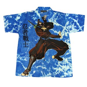 May include: A blue and white tie-dye short-sleeved button-up shirt with a graphic of a ninja holding a sword. The text "忍者戦士" is printed on the shirt.