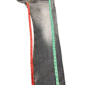 May include: A set of three ceramic mugs with a speckled, matte finish. Each mug features a different color: light blue, cream, and gray. The mugs have a simple, modern design and a comfortable handle.