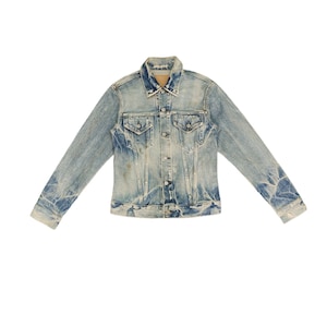 May include: A light blue denim jacket with a button closure and two front pockets. The jacket has a faded and distressed look.