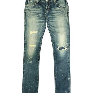 May include: A set of three ceramic mugs with a speckled, cream-colored glaze. Each mug features a different hand-painted floral design in shades of blue, green, and yellow. The mugs have a simple, rounded shape and a comfortable handle.