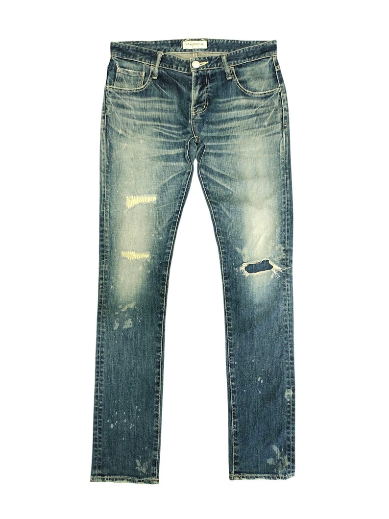 May include: A set of three ceramic mugs with a speckled, cream-colored glaze. Each mug features a different hand-painted floral design in shades of blue, green, and yellow. The mugs have a simple, rounded shape and a comfortable handle.