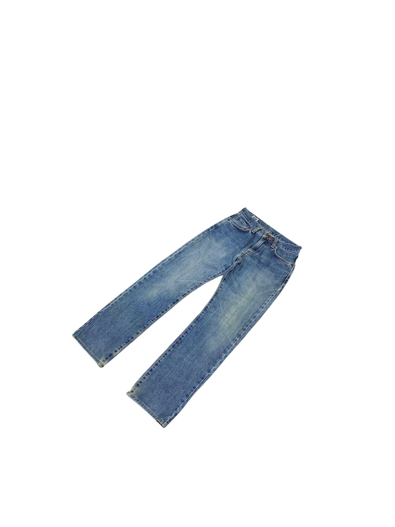 May include: A set of three ceramic mugs with a speckled, matte finish. The mugs are in shades of cream, light gray, and dark gray. Each mug has a simple, minimalist design and a rounded handle.