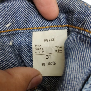 May include: A white tag with black text that reads "MG713", "Size 31", "Waist 78 cm", "Hip 96 cm", and "Cotton 100%".