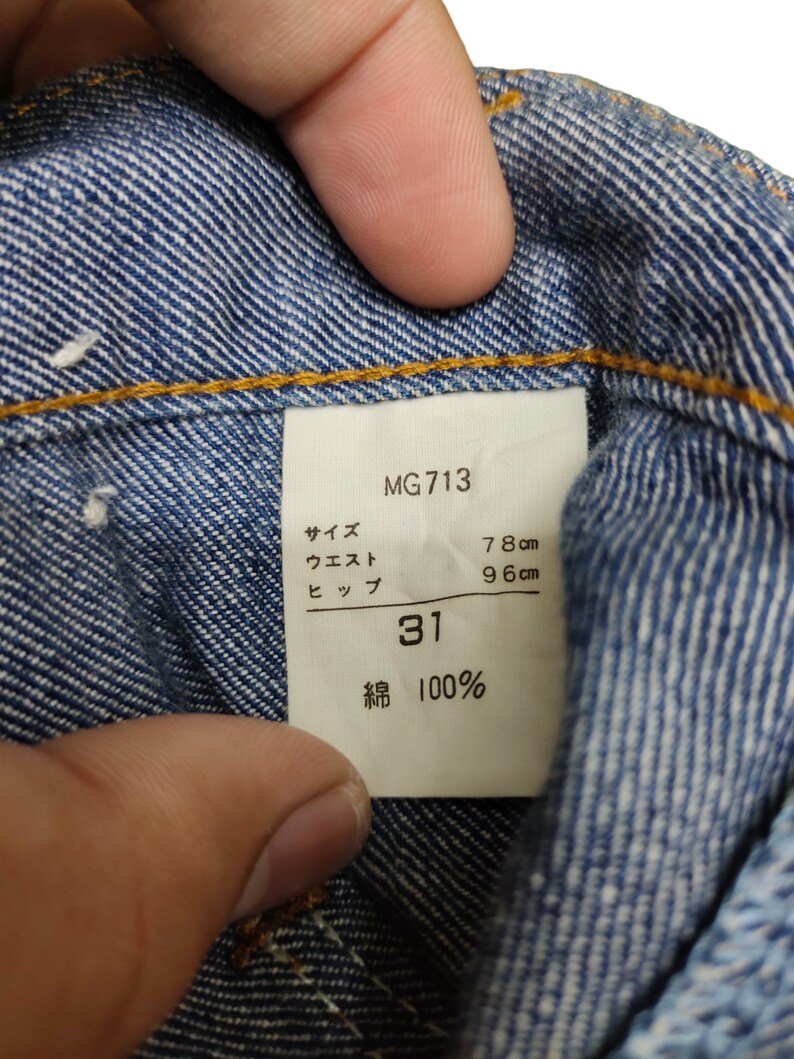 May include: A white tag with black text that reads "MG713", "Size 31", "Waist 78 cm", "Hip 96 cm", and "Cotton 100%".