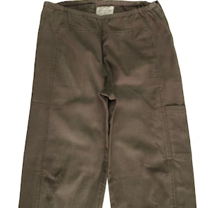 May include: A pair of brown cargo pants with a drawstring waist and multiple pockets.