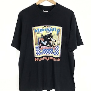 May include: Black t-shirt with a graphic print of a band called "Klammydia". The graphic features a band in a room with a checkered floor.