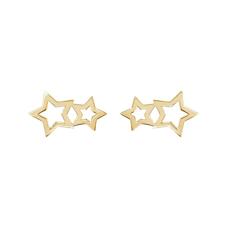May include: A pair of gold-tone earrings featuring three interlocking star shapes.
