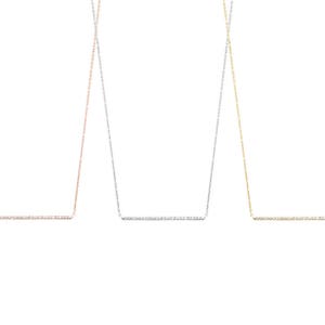 All three color options of the solid gold necklace with a thin cable chain and a diamond bar. Rose, white and yellow gold, every option displayed right next to each other on a white background.