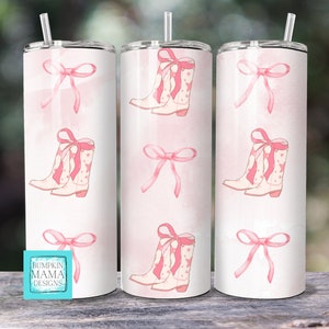 May include: Three pink and white stainless steel tumblers with a pattern of pink bows and cowboy boots with pink bows. The tumblers have a white background with a pink watercolor effect. The text "Bumpkin Mama Designs" is on the bottom of one tumbler.