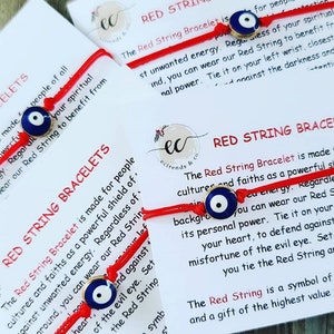 May include: Red string bracelets with an evil eye charm. The bracelets are made for people of all cultures and faiths as a powerful shield against unwanted energy. The text on the card reads "The Red String Bracelet is made for people of all cultures and faiths as a powerful shield against unwanted energy. Regardless of its personal power. Tie it on your left wrist, closest to your heart, to defend against the curse of the evil eye. Set a positive intention as you tie the Red String around your wrist. The Red String is a symbol of protection and a gift of the highest value from the universe."