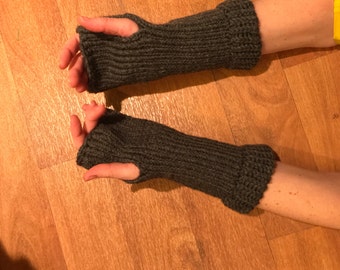 Grey knitted fingerless gloves.