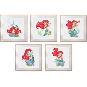 May include: Five framed art prints featuring a red-haired mermaid with a turquoise tail. Each print showcases the mermaid in different poses, surrounded by aquatic elements. The artwork is presented in a light wood frame, suitable for a child's room or a themed space.