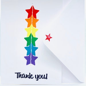 Tarjeta de agradecimiento con estrella arcoíris en blanco: todas las ganancias se destinarán a NHS Charities Together