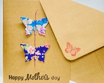 Two Butterflies On Brown Card