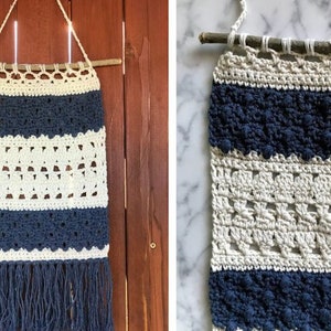 May include: A crocheted wall hanging with a blue and white striped pattern. The hanging is made with a variety of stitches and has a fringe at the bottom.