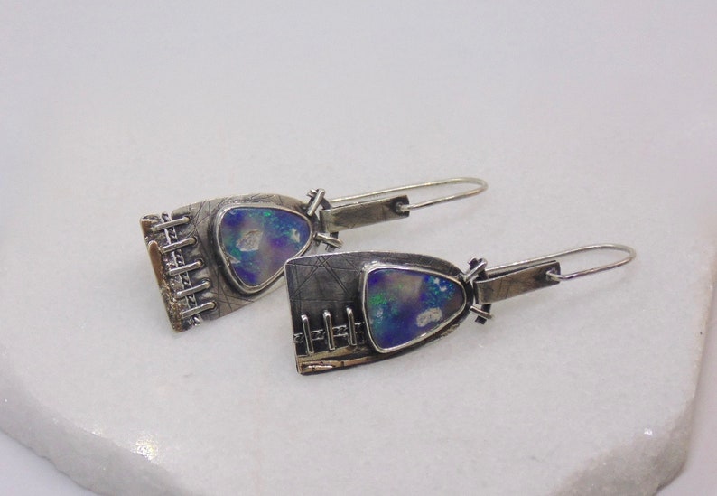 contemporary industrial  style asymmetrical earrings with Australian Lightning Ridge natural  Opal rubs in silver