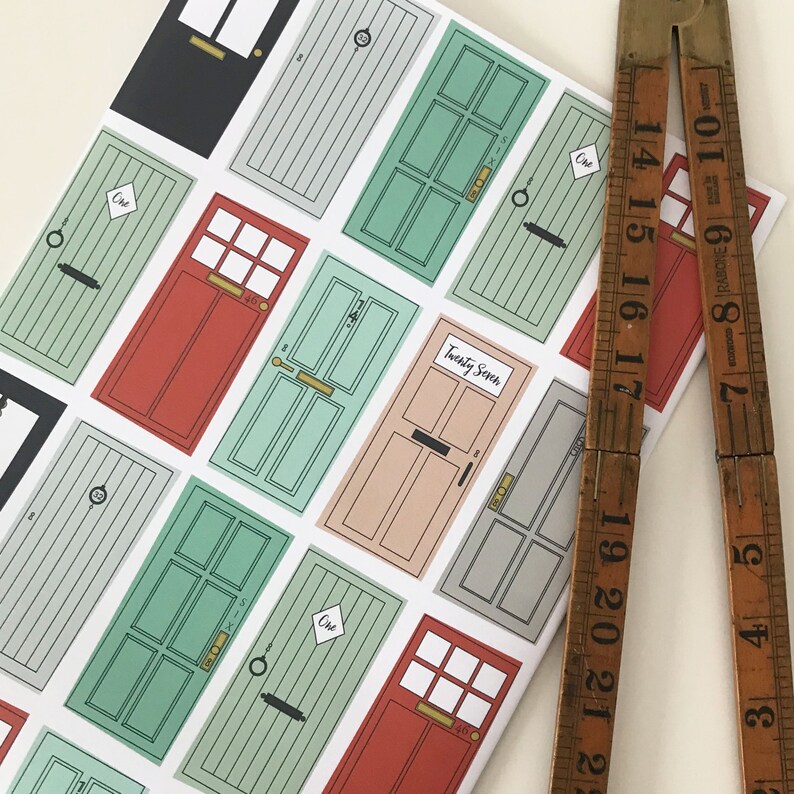 May include: A white sheet of paper with colorful illustrations of doors. Each door has a different number, including "One" and "Twenty Seven".