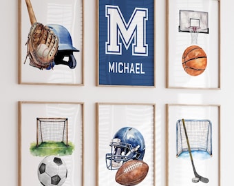 May include: A set of eight watercolor prints featuring different sports equipment, including a baseball bat and glove, a basketball, a football helmet, a soccer ball, a hockey stick and net, and a soccer goal. The prints are framed in wood and have a white background. The prints are arranged in a grid pattern on a white wall. The name "MICHAEL" is printed on one of the prints.