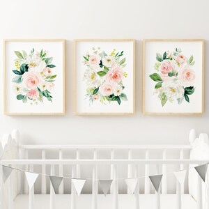 May include: Three framed prints with watercolor floral designs. Each print features a bouquet of pink and white roses with green leaves.
