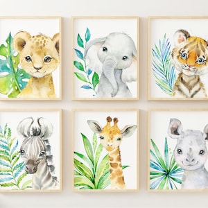 May include: Set of six watercolor animal prints featuring a lion, elephant, tiger, zebra, giraffe, and rhinoceros. Each animal is depicted with a cute, cartoonish style and surrounded by lush green tropical leaves.
