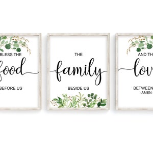 May include: Three framed prints with a white background and green foliage designs. The text on the prints reads "Bless the food before us", "The family beside us", and "And the love between us - Amen -."