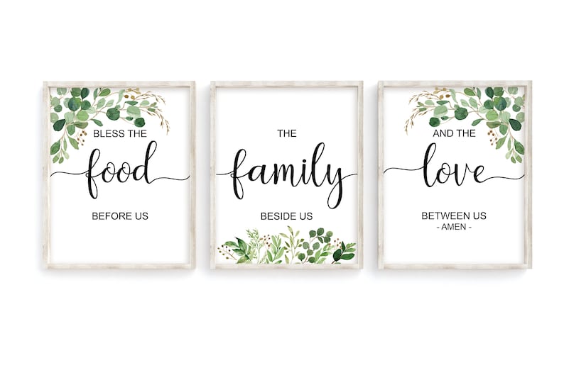 May include: Three framed prints with a white background and green foliage designs. The text on the prints reads "Bless the food before us", "The family beside us", and "And the love between us - Amen -."