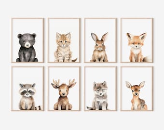 May include: Set of eight watercolor illustrations of woodland animals, including a bear, cat, rabbit, fox, raccoon, deer, wolf, and a reindeer. Each animal is depicted in a simple, cartoon style with a white background.