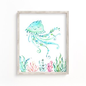 May include: A watercolour painting of a blue and green jellyfish with a smiling face. The jellyfish is surrounded by green seaweed and coral.