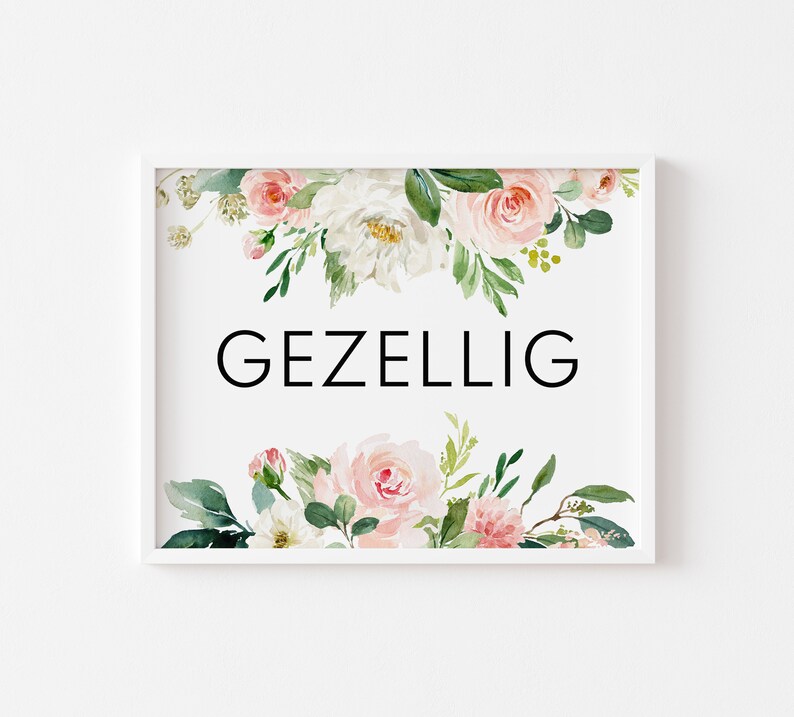 May include: White framed print with a floral design in shades of pink and green. The text "GEZELLIG" is printed in black in the center of the print.