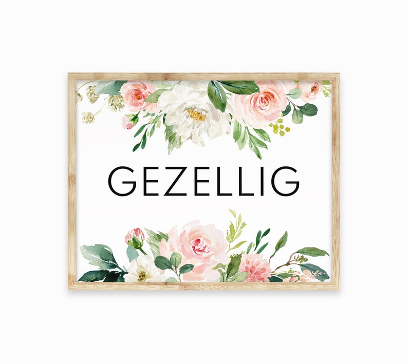 May include: A framed print with a white background and a floral design in shades of pink and green. The text "GEZELLIG" is printed in black in the center of the print.