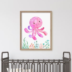 May include: A framed watercolour illustration of a pink octopus with a crown, surrounded by colourful seaweed and coral.