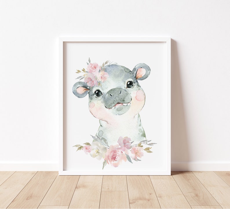 May include: A watercolour painting of a grey hippopotamus with pink flowers around its head. The hippopotamus is smiling and looking at the viewer. The background is white.