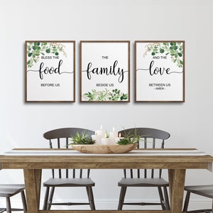 May include: Three framed prints with a white background and green watercolor foliage. The prints have black text that reads "Bless the food before us", "The family beside us", and "And the love between us -Amen-".