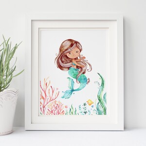 May include: A watercolour illustration of a mermaid with long brown hair, a turquoise tail, and coral and seaweed surrounding her.