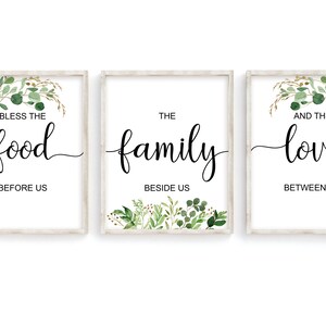 May include: Three framed prints with a white background and green foliage. The text on the prints reads "Bless the food before us", "The family beside us", and "And the love between us".