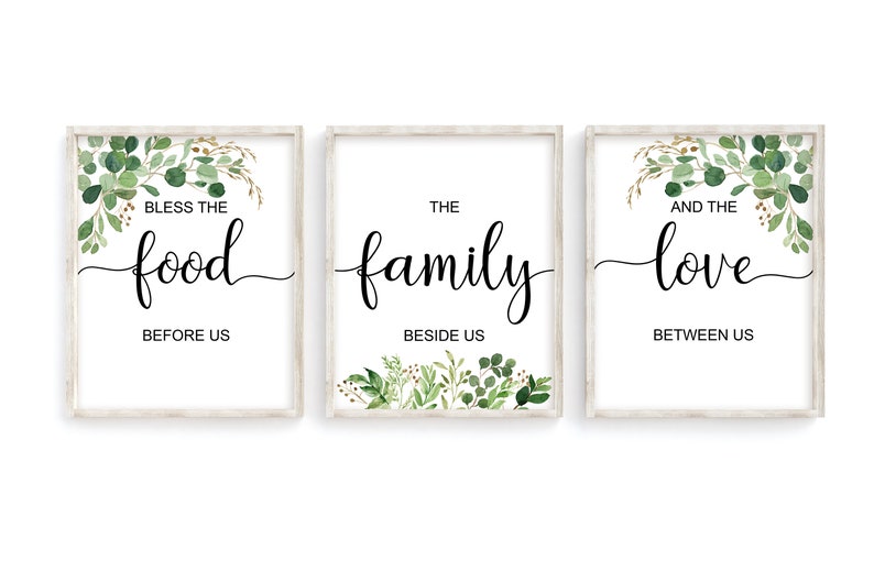 May include: Three framed prints with a white background and green foliage. The text on the prints reads "Bless the food before us", "The family beside us", and "And the love between us".