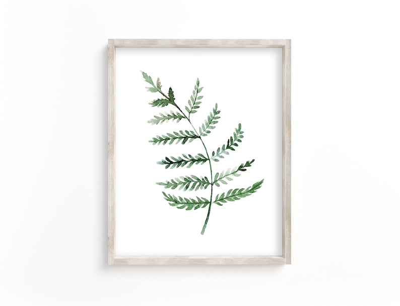 May include: A framed watercolor painting of a single green fern leaf on a white background.