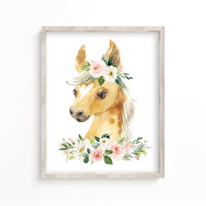 May include: Watercolor painting of a light brown horse with a floral crown. The crown is made of pink and white flowers and green leaves. The horse has a white mane and tail.