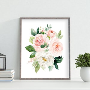 May include: A watercolor painting of a bouquet of pink and white roses with green leaves. The flowers are arranged in a loose, natural style. The painting is framed in a simple gray frame.