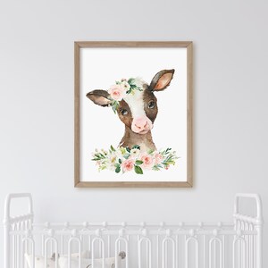 May include: A watercolor painting of a brown and white calf with a pink flower crown. The calf is looking at the viewer with a sweet expression. The background is white.