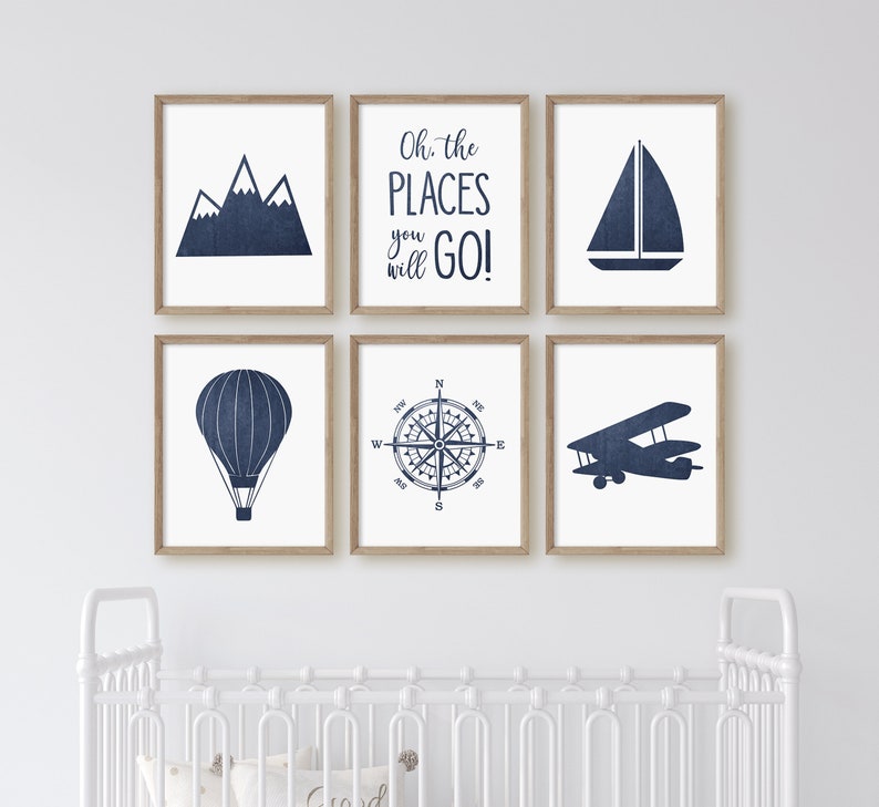 May include: Set of six navy blue and white nursery prints with illustrations of mountains, a sailboat, a hot air balloon, a compass, an airplane, and the text "Oh, the places you will go!"