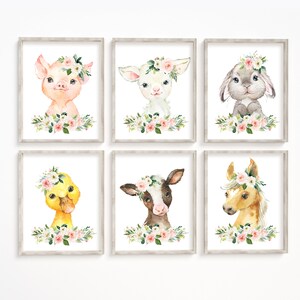 May include: Six watercolor illustrations of farm animals with floral crowns. Each animal is framed in a light wood frame. The animals include a pig, a lamb, a rabbit, a duck, a calf, and a horse.