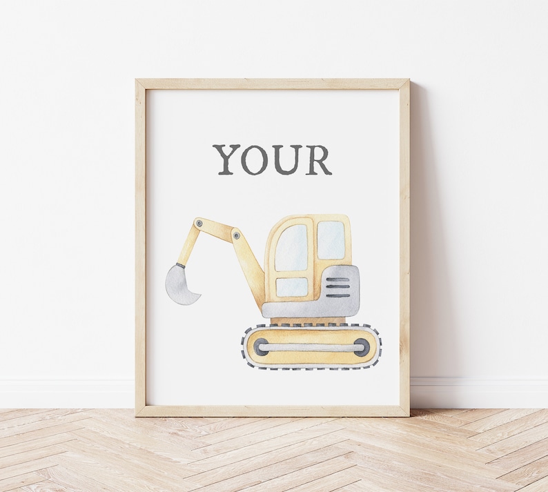 May include: Watercolor illustration of a yellow and gray excavator on a white background, framed in a light wood frame. The word "YOUR" is printed in gray at the top. The excavator is a construction-themed artwork.