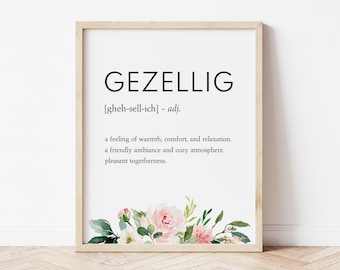 May include: A printable wall art print with the Dutch word "Gezellig" defined as a feeling of warmth, comfort, and relaxation. The print features a watercolor floral design with pink and white flowers.