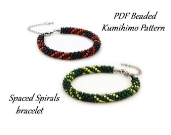 May include: Two beaded bracelets with a black and red pattern and a green and gold pattern. The bracelets are made with small beads and have a metal clasp. The text "PDF Beaded Kumihimo Pattern" and "Spaced Spirals bracelet" is visible in the image.