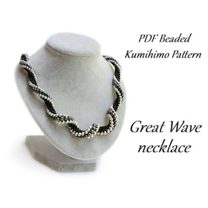 May include: A black and silver beaded necklace on a gray mannequin. The necklace is a kumihimo pattern called "Great Wave". The text "PDF Beaded Kumihimo Pattern" is above the necklace and the text "Great Wave necklace" is below the necklace.