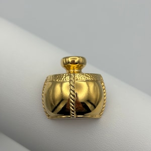 Yves Saint Laurent, 80s vintage gold plated perfume bottle lapel pin
